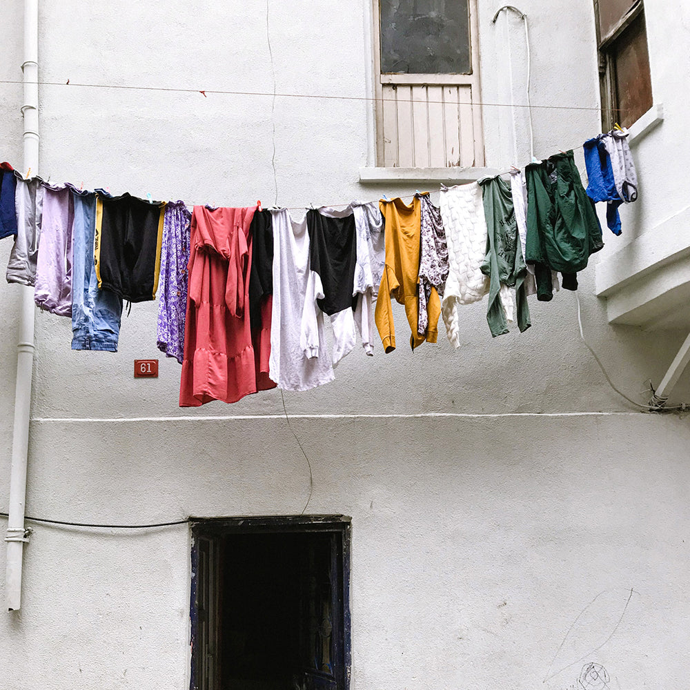 clothes drying hanging on clothing line dryer