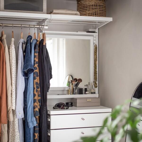 A White Elfa Decor Click In Mirror installed as a wall-mounted wardrobe mirror