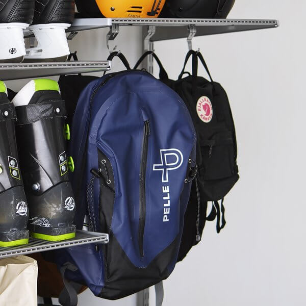 Three bags hanging on Platinum Elfa Shelf Hooks in a garage