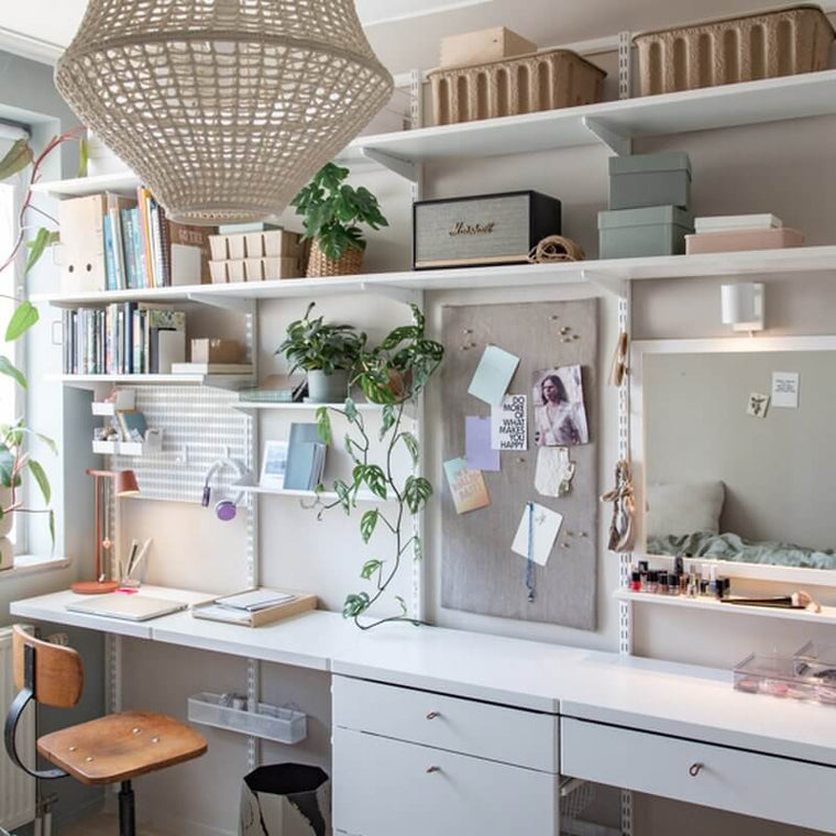 White Elfa Decor Shelves, Reversible Metal Shelf Trays and Decor Drawer Fronts installed in a home office