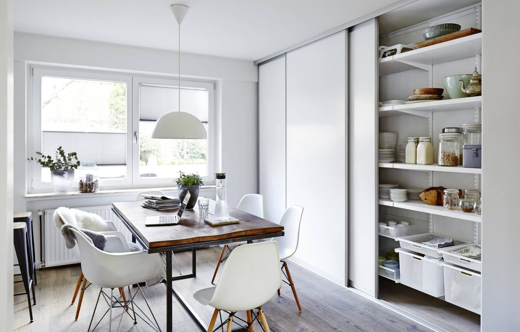 A White Elfa pantry storage system, with white wooden pantry shelves and Gliding Mesh Drawers