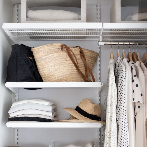 White Elfa Decor Shelf Fascias installed on wire wardrobe shelving