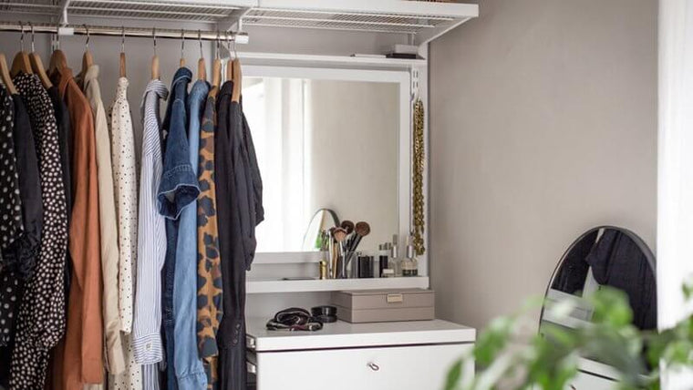 An Elfa Click In Mirror installed in a white wardrobe